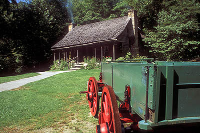 NC: Transylvania County, Pisgah National Forest, Davidson River Area, The Cradle of Forestry In America, Restored log cabin; wagon. Near Brevard [Ask for #188.026.]