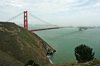 CA: Bay Area Region, Marin County, Marin Peninsula, Golden Gate National Recreation Area, Conzelman Road, Marin Headlands, View towards the Golden Gate Bridge, as fog envelops it [Ask for #271.079.]