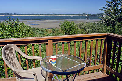 OR: South Coast Region, Coos County, Coos Bay Area, City of Coos Bay, Empire District, View west over Coos Bay towards Oregon Dunes National Recreation Area, from the deck of a vacation rental [Ask for #271.111.]