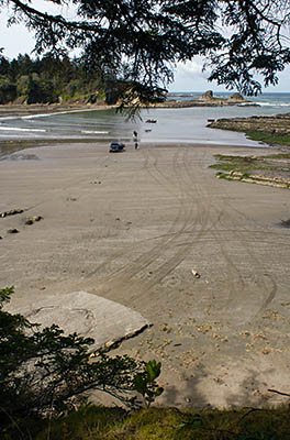 OR: Coos County, Coos Bay Area, Cape Arago Parks, The Bay, Golden sand beach surrounded by cliffs; people launch boat from beach [Ask for #274.013.]