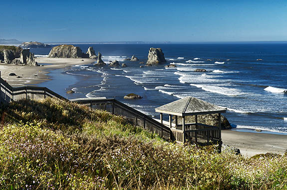 OR: South Coast Region, Coos County, Bandon Area, South Beaches, Coquille Point, Stairs lead down a grassy cliff to a sand beach spotted with large hoodoos [Ask for #274.346.]