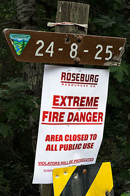 OR: South Coast Region, Douglas County, Coast Range, Reedsport Area, Camp Creek Area (BLM), Tyee Area, Poster on a BLM road sign warns of fire danger [Ask for #274.641.]