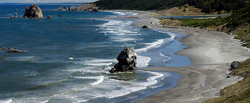 OR: South Coast Region, Curry County, North Coast, Cape Blanco Area, Cape Blanco State Park, View of Cape Blanco with its quiet, protected beach, large hoodoos, and grass-topped cliffs [Ask for #274.681.]