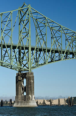 OR: South Coast Region, Coos County, Coos Bay Area, City of North Bend, North Point, McCullough Bridge (US 101), The center pier of this 1936 cantilevered steel truss bridge named for its designer, with Oregon Dunes NRA sand dunes behind [Ask for #274.935.]