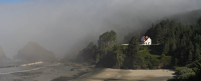 OR: South Coast Region, Lane County, Pacific Coast, Cliffs, Heceta Head, Beach beneath the lighthouse keepers cottage, now a B&B, in fog [Ask for #276.985.]