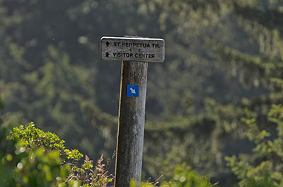 OR: South Coast Region, Lane County, Pacific Coast, Cape Perpetua Area, Cape Perpetua National Scenic Area, Cape Perpetua Overlook, Wood trail sign gives directions for St. Perpetua Trail [Ask for #276.A01.]