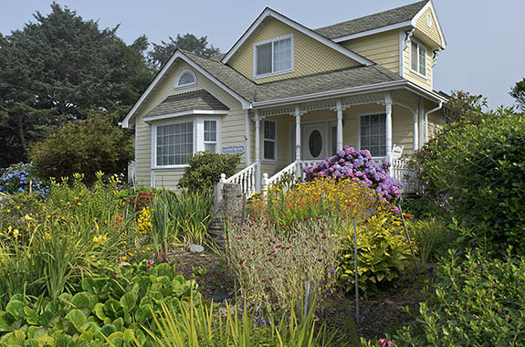 OR: North Coast Region, Lincoln County, Pacific Coast, Yachats Area, Yachats Proper, Victorian style home with cottage garden in bloom [Ask for #276.A06.]