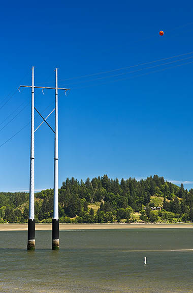 OR: North Coast Region, Lincoln County, Pacific Coast, Waldport Area, Waldport Proper, Robinson Park, Power lines cross the Alsea River near the park's boat ramp [Ask for #276.A30.]