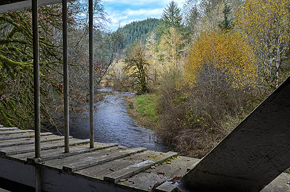 OR: South Coast Region, Lane County, Coast Range, Hwy 36 Corridor, Deadwood Area, Deadwood Covered Bridge, Covered bridge carrying traffic for a gravel road. View from bridge's window over Deadwood Creek. [Ask for #277.438.]