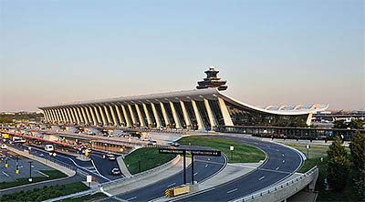 VA: Washington Region, Loudoun County, Washington's Outer Suburbs, Dulles International Airport,  Main Terminal of Washington Dulles International Airport at dusk. Photo by Joe Ravi, sourced from Wikimedia Commons (http://tinyurl.com/qxxzjat) [Ask for #998.008.]